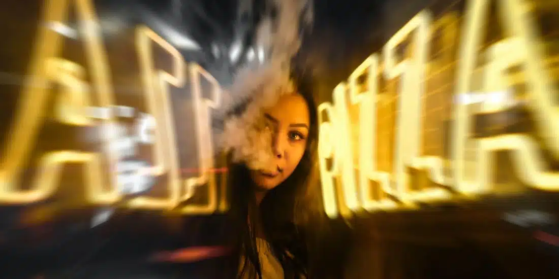 woman near yellow neon sign